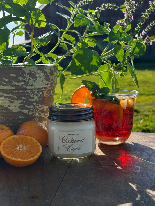 a picture of a candle with a label that says Gathered Light