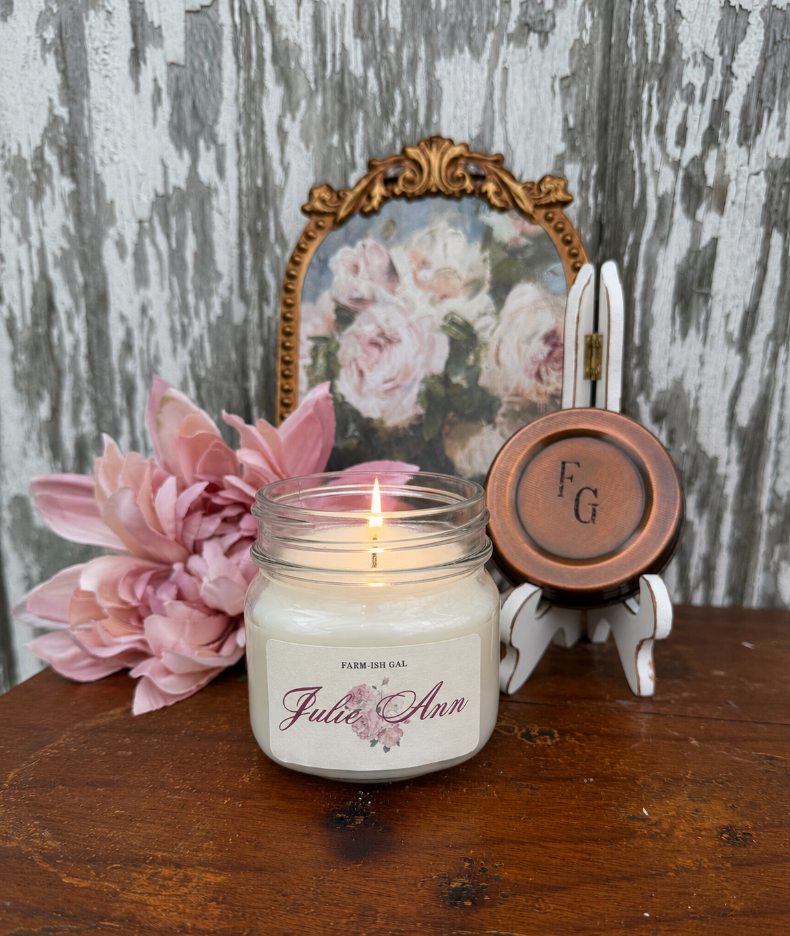 A candle with a label that says Julie Ann