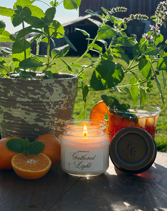 A picture of a candle with a label that says Gathered light
