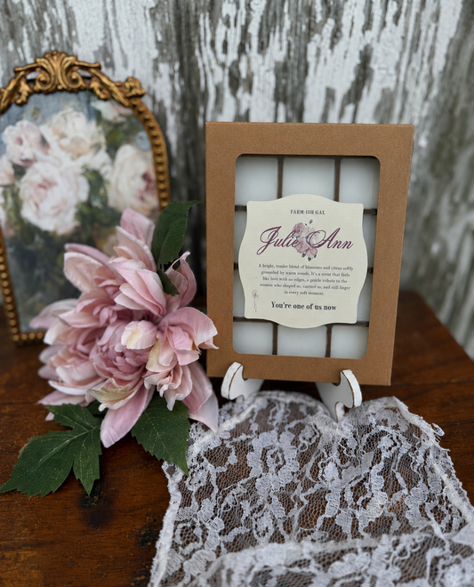 Wax melts in brown cardboard container with clear plastic window and a label that says Julie Ann