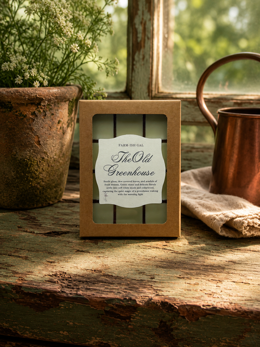Wax melts in cardboard box with clear plastic window with a label saying The Old Greenhouse.