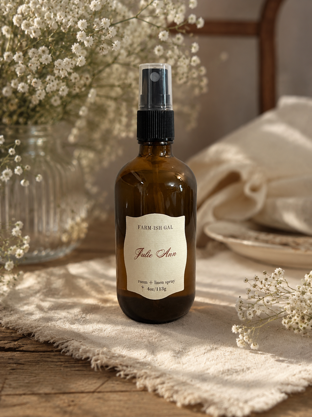 amber fine mist spray bottle with a label that says Julie Ann